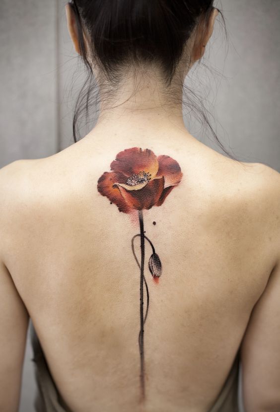 tatouage Fleur marron colonne vertebrale