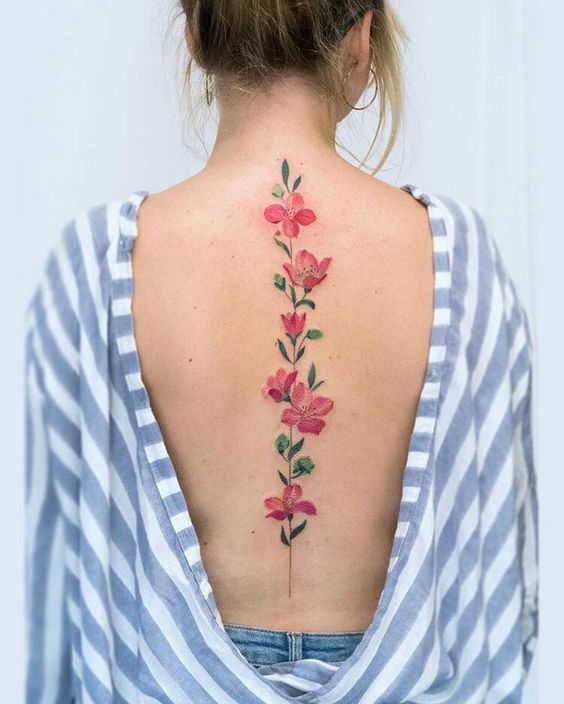 tatouage Fleurs roses colonne vertebrale