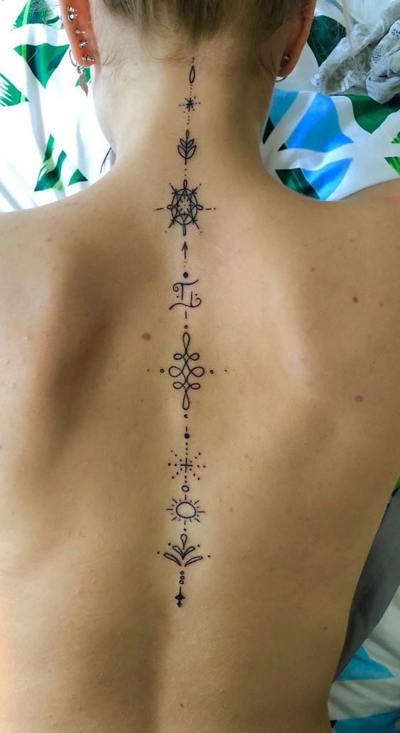 tatouage Lotus, soleil et eau colonne vertebrale